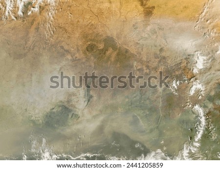 Dust and fires across Central Africa. Dust and fires across Central Africa. Elements of this image furnished by NASA. Royalty-Free Stock Photo #2441205859