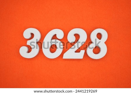 Orange felt is the background. The numbers 3628 are made from white painted wood.