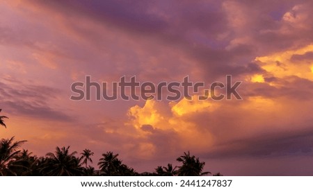 Nature sunset sky aerial view. Top view evening atmosphere when the cloud sky golden time. Countryside road that cuts through. Photo for background feeling free, mood and tone relax happy time