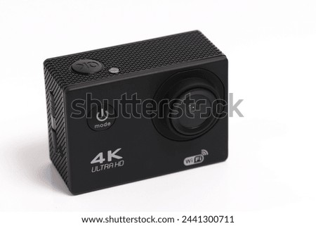 4K action camera on a white background Royalty-Free Stock Photo #2441300711