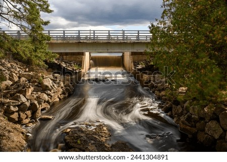 Horizontal ND picture of Black River falling over spillway