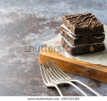 Stack of Chocolate Brownies on a cutting board ready to serve