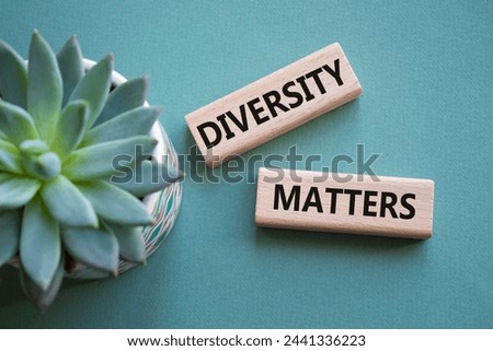 Diversity matters symbol. Wooden blocks with words Diversity matters. Beautiful grey green background with succulent plant. Business and Diversity matters concept. Copy space.