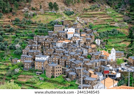 View of the Piodão village in Portugal. Rural tourism. Beautifully built upon the ledges of the mountain, the village of Piódão is harmoniously carved into nature with its schist houses and streets.