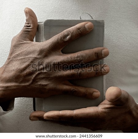 praying to God with hands together on grey black background with people stock image stock photo	
