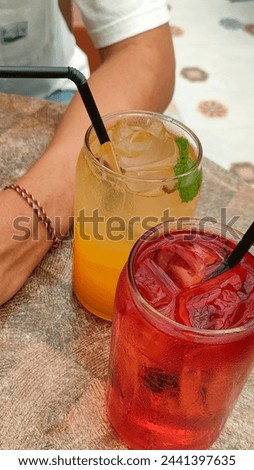 Quench your thirst for vibrant visuals with refreshing juice Royalty-Free Stock Photo #2441397635