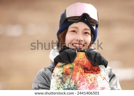Image of a woman in snowboarding wear
