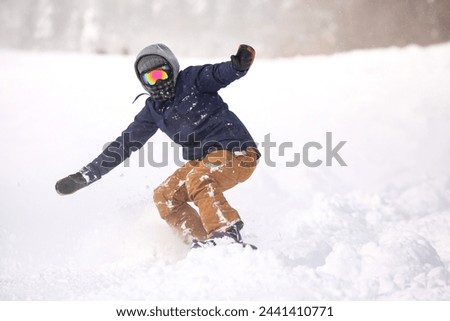 Image of a man snowboarding
