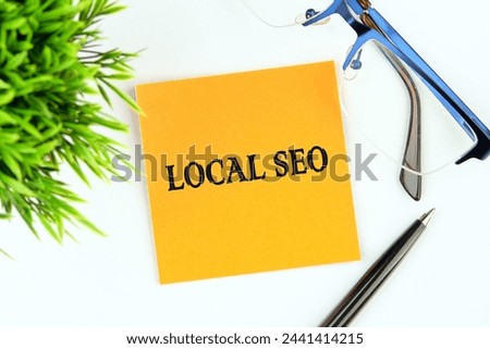 LOCAL SEO text written on an orange sticker on a white background