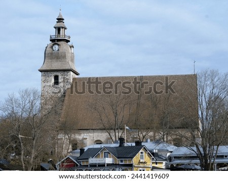 The beautiful white stone church is a capturing sight in the skyline of Naantali. The church was built between the 1460s and 80s as a church for a Catholic St. Bridget’s convent. Royalty-Free Stock Photo #2441419609