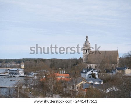 The beautiful white stone church is a capturing sight in the skyline of Naantali. The church was built between the 1460s and 80s as a church for a Catholic St. Bridget’s convent. Royalty-Free Stock Photo #2441419611