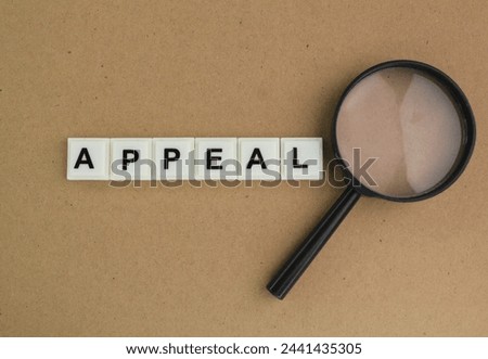 magnifying glass with words of appeal. appeal concept. ask to be released or be released Royalty-Free Stock Photo #2441435305