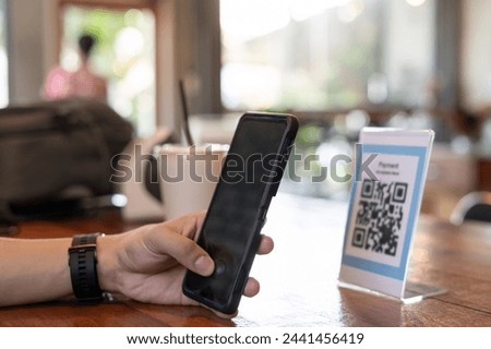 man use smartphone to scan QR code for order menu in cafe restaurant with a digital delivery. Choose menu and order accumulate discount. E wallet, technology, pay online, credit card, bank app.