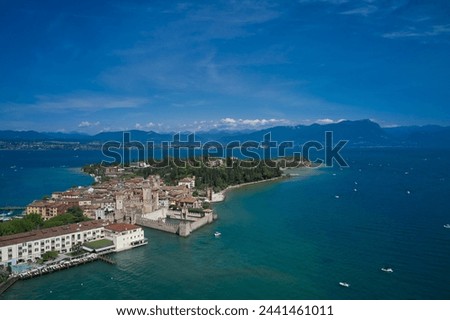 Sirmione, Lake Garda, Italy. Unique aerial view of the central city of Sirmione. In the summer season. Blue water of the lake