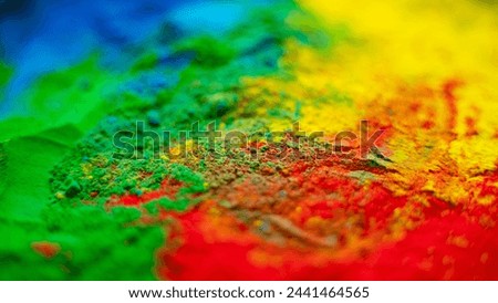 Holi colorful background, close-up shot of Powder Color or Gulal Royalty-Free Stock Photo #2441464565
