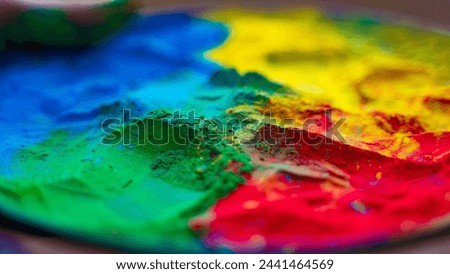 Holi colorful background, close-up shot of Powder Color or Gulal Royalty-Free Stock Photo #2441464569