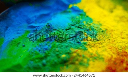 Holi colorful background, close-up shot of Powder Color or Gulal Royalty-Free Stock Photo #2441464571