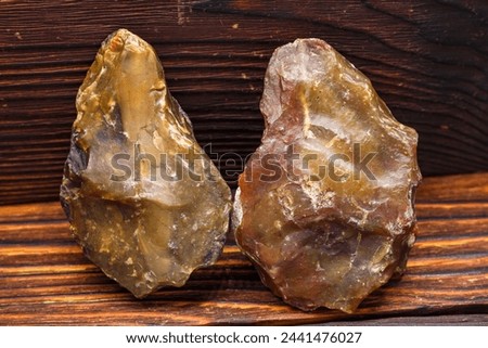 Roughly processed stone scrapers made of chalcedony, a Stone Age tool Royalty-Free Stock Photo #2441476027