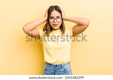 pretty hispanic woman feeling frustrated and annoyed, sick and tired of failure, fed-up with dull, boring tasks