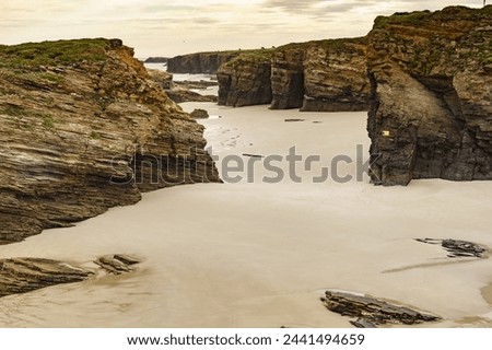 Cliff formations on Cathedral Beach in Galicia Spain. Playa de las Catedrales, As Catedrais in Ribadeo, province of Lugo. Cantabric coastline in northern Spain. Tourist attraction. Royalty-Free Stock Photo #2441494659
