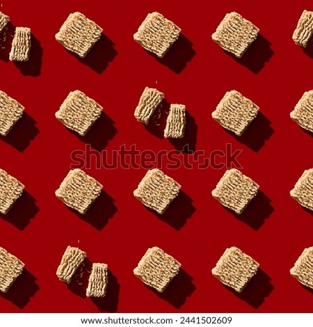Chinese instant ramen noodles on red background seamless pattern. Retro style 80-90s food photography. High quality photo