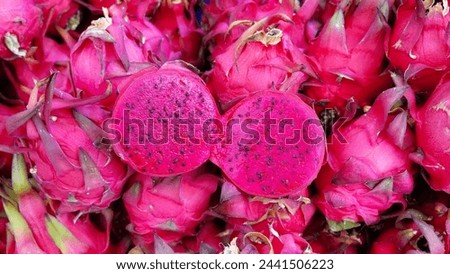 Exotic Dragon Fruit: A Vibrant Delight. The Vivid Pink Flesh and Black Seeds of a Freshly Cut Pitaya. Close-up