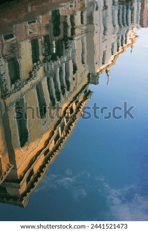 Reflection of houses in a still canal in the Dorsoduro area, Venice, UNESCO World Heritage Site, Veneto, Italy, Europe Royalty-Free Stock Photo #2441521473