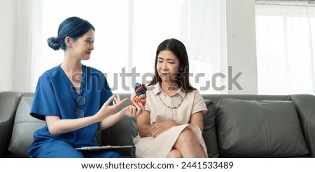 Caregiver, nurse talking about diagnosis, illness prevention, test results, medical insurance with old elderly senior patient in hospice at home Royalty-Free Stock Photo #2441533489