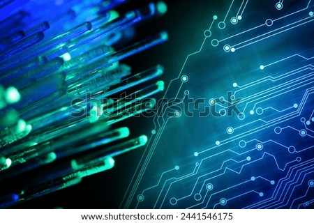 Optical fiber strands and circuit board on black background Royalty-Free Stock Photo #2441546175