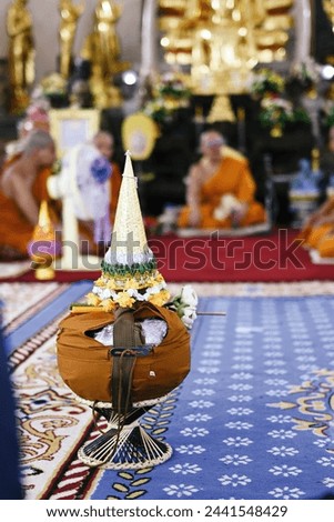 close up monk's alms bowl and cloth for the rains in temple, buddhist holy day, thai buddhist monk ordination ceremony wallpaper background concept