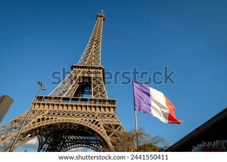 French flag ( flag of france) in front of the Eiffel Tower, 1889, Champ de Mars, Paris, France, Western Europe Royalty-Free Stock Photo #2441550411