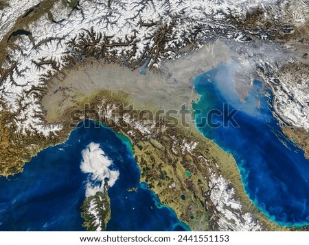 Haze in northern Italy. A grey veil of haze covers the Po River Valley of northern Italy and stretches out over the Adriatic Sea in this. Elements of this image furnished by NASA.