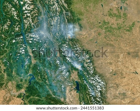 Fires in Montana and Alberta. . Elements of this image furnished by NASA.