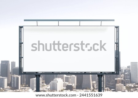 Blank white horizontal billboard on skyline background at daytime, front view. Mock up, advertising concept