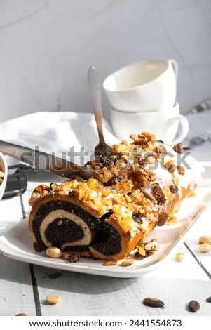Roll with poppy seeds on a wooden background. dessert