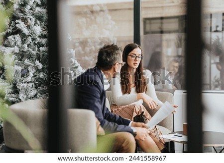 Successful collaboration and strategizing with business partners in a cozy workplace. Royalty-Free Stock Photo #2441558967