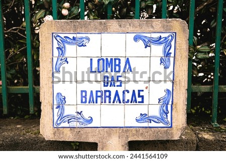 In the Azores, to the city of Furnas, street name sign. The sign reads: Lomba Das Barracas.