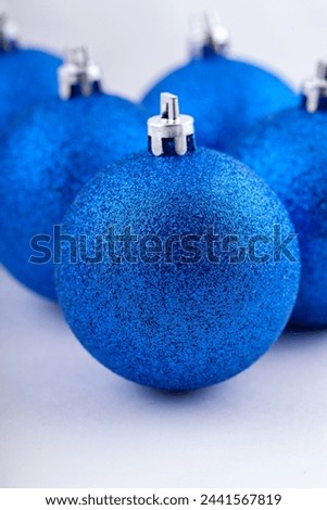 Blue Christmas balls, first in focus, Christmas toy to decorate the Christmas tree