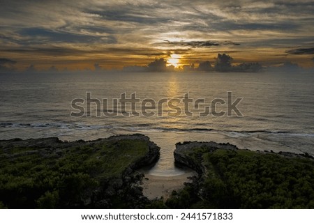 View of sunrise at Anse Bouteille located on the west coast of Rodrigues island