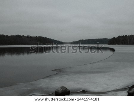 half frozen lake in the archipelago in Stockholm, Sweden Royalty-Free Stock Photo #2441594181