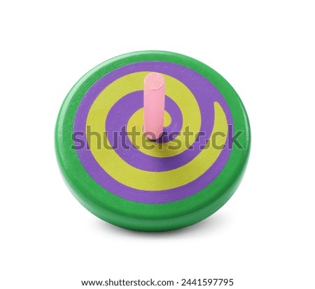 One bright spinning top isolated on white