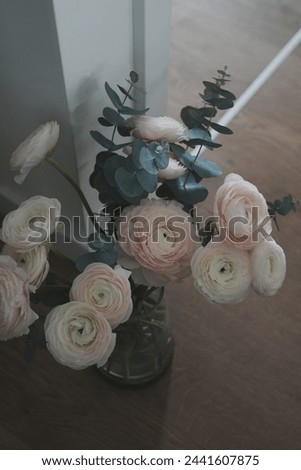 Bouquet of blooming ranunculus and eucalyptus