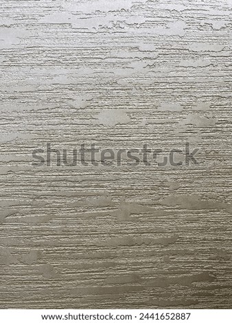 Textured colored plaster, can be used for the background. It has a pronounced structure.