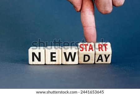 New day and start symbol. Concept word New day New start on beautiful wooden cubes. Beautiful grey table grey background. Businessman hand. Business new day and start concept. Copy space.