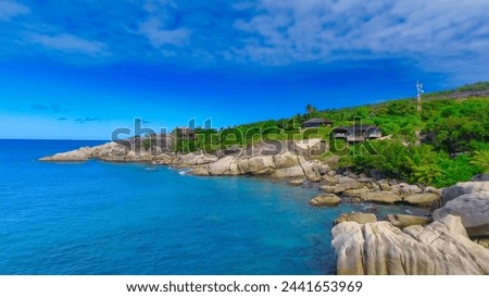 Felicite Island, close to La Digue, Seychelles. Aerial view of tropical coastline on a sunny day. Royalty-Free Stock Photo #2441653969