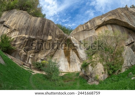 The Stone Crows (Romanian: Corbii de Piatra) called The Outlaw's Stone. Village of Jgheaburi, Corbi commune, Arges county, Romania. Local legend says that it is endowed with cosmic energy properties. Royalty-Free Stock Photo #2441668759