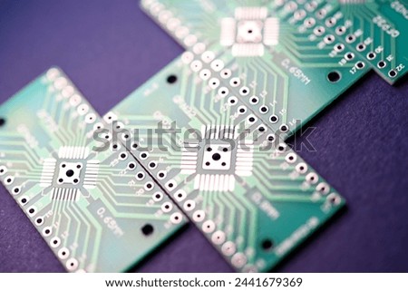 Green printed circuit boards for soldering radio components.  A set for a beginner amateur radio operator.
