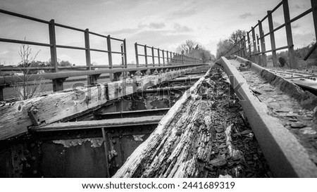 disused derelict railway bridge abandoned Royalty-Free Stock Photo #2441689319