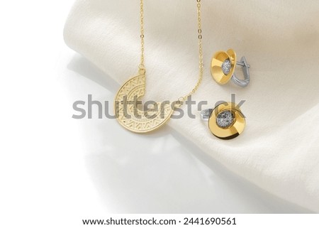 Elegant jewelry set. Jewellery set with gemstones. Product still life concept. Ring, necklace and earrings.