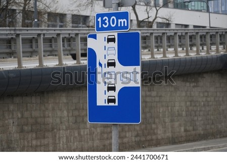 A road sign showing a way to relieve traffic jams, road sign solutions for relieving traffic congestion, car traffic jams in the city. Royalty-Free Stock Photo #2441700671